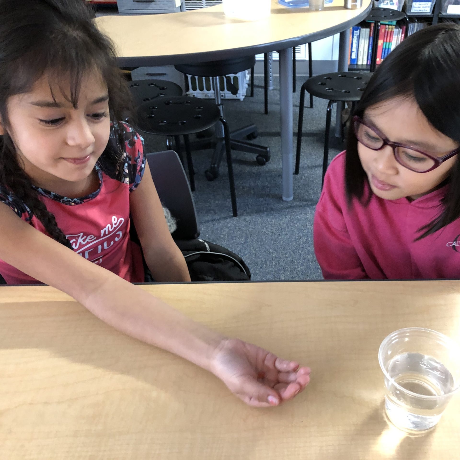 Kids holding salmon eggs