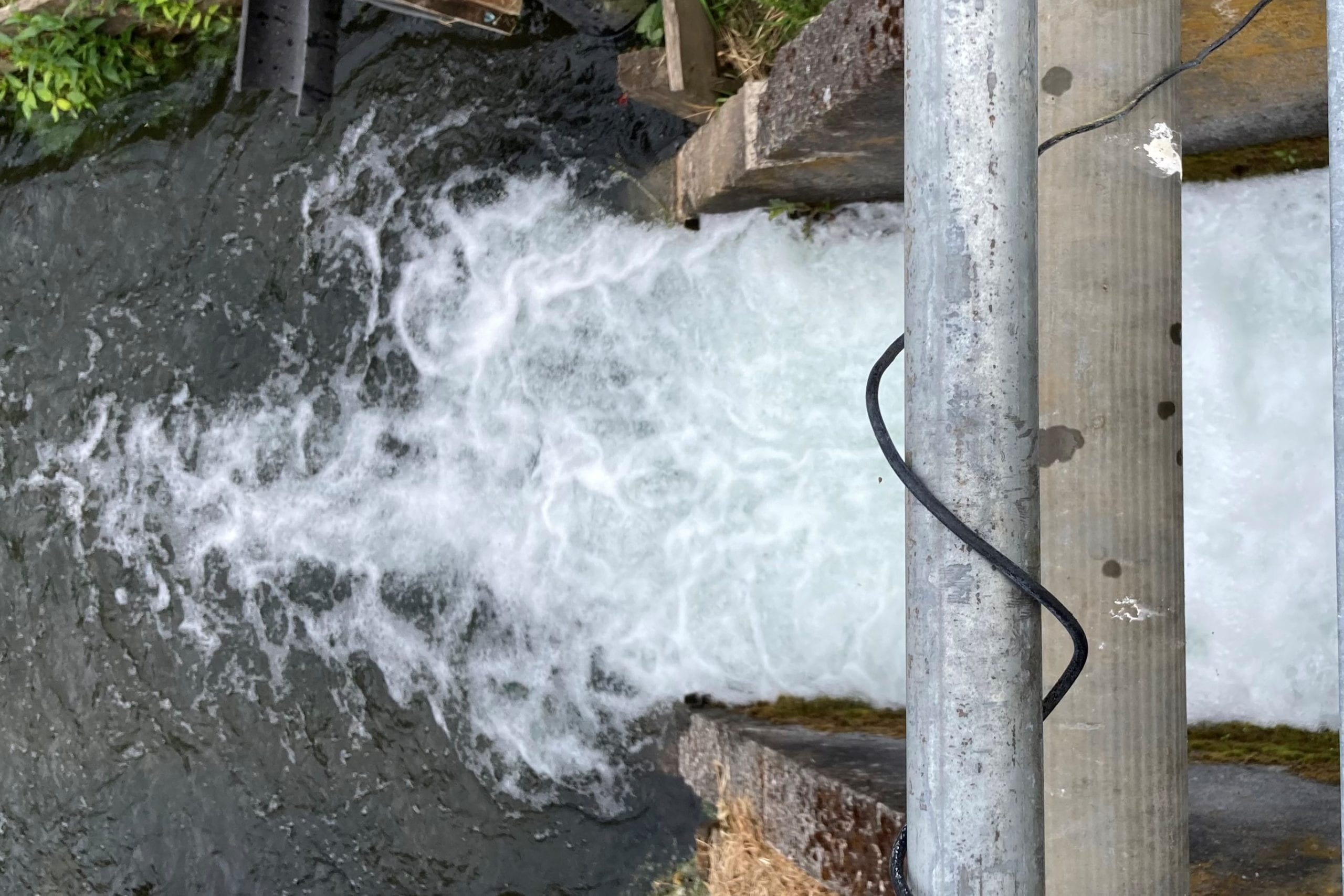 water flowing through west biddle lake dam