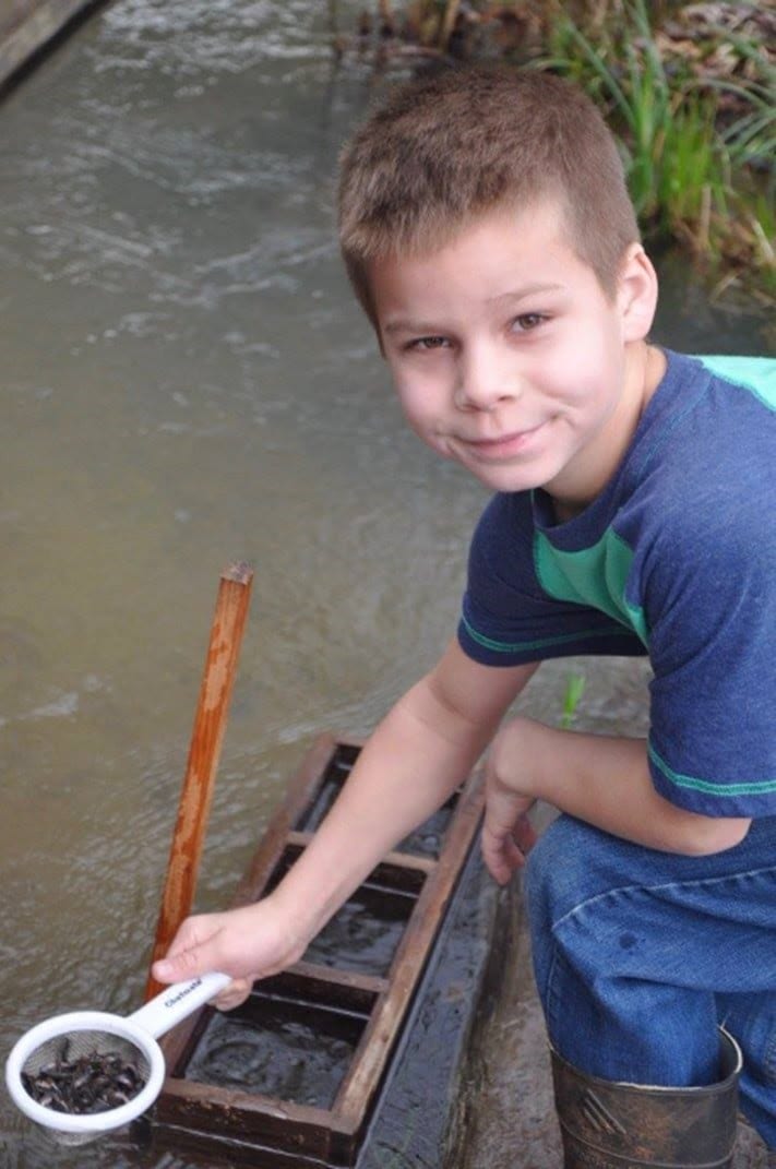 Student at annual salmon release