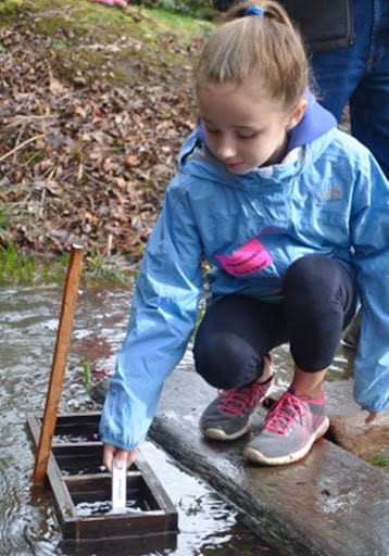 Student at annual fish release